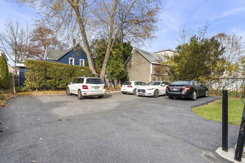 98 Paradise Road, Unit 1 Swampscott, MA 01907 - Photo 9 of 10 a car parked on the side of a street