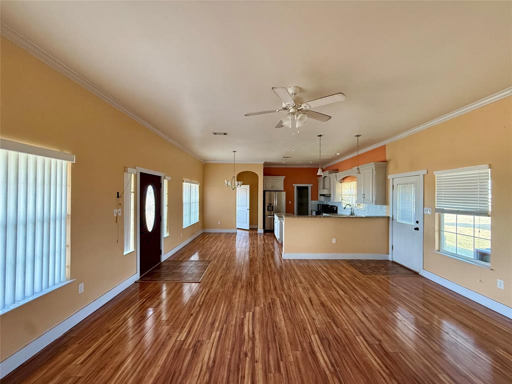 487 County Road 2622 Decatur, TX 76234 - Photo 3 of 20 a view of a living room hardwood and kitchen with wooden floor