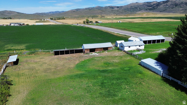 114 West 7th Street Georgetown, ID 83239 - Photo 71 of 71 Expansive grounds featuring multiple outbuildings, fencing, and mature trees