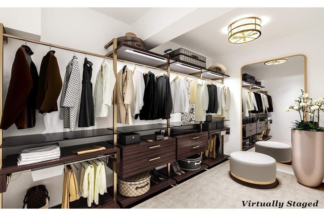 249 East 48th Street, Unit 10B Manhattan, NY 10017 - Photo 11 of 18 a view of walk in closet with clothes and shoes