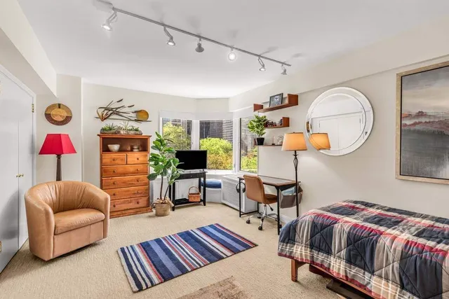 a bathroom with a toilet sink and shower