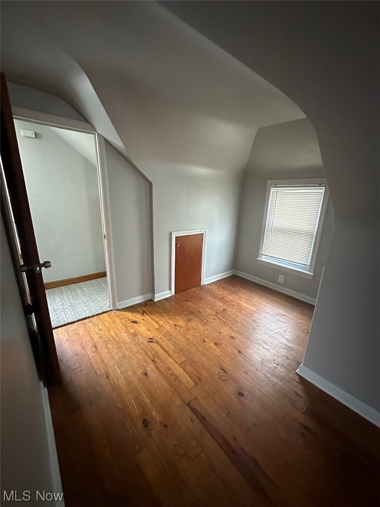 4994 North Barton Road Cleveland, OH 44124 - Photo 12 of 28 Additional living space featuring light wood-type flooring and lofted ceiling
