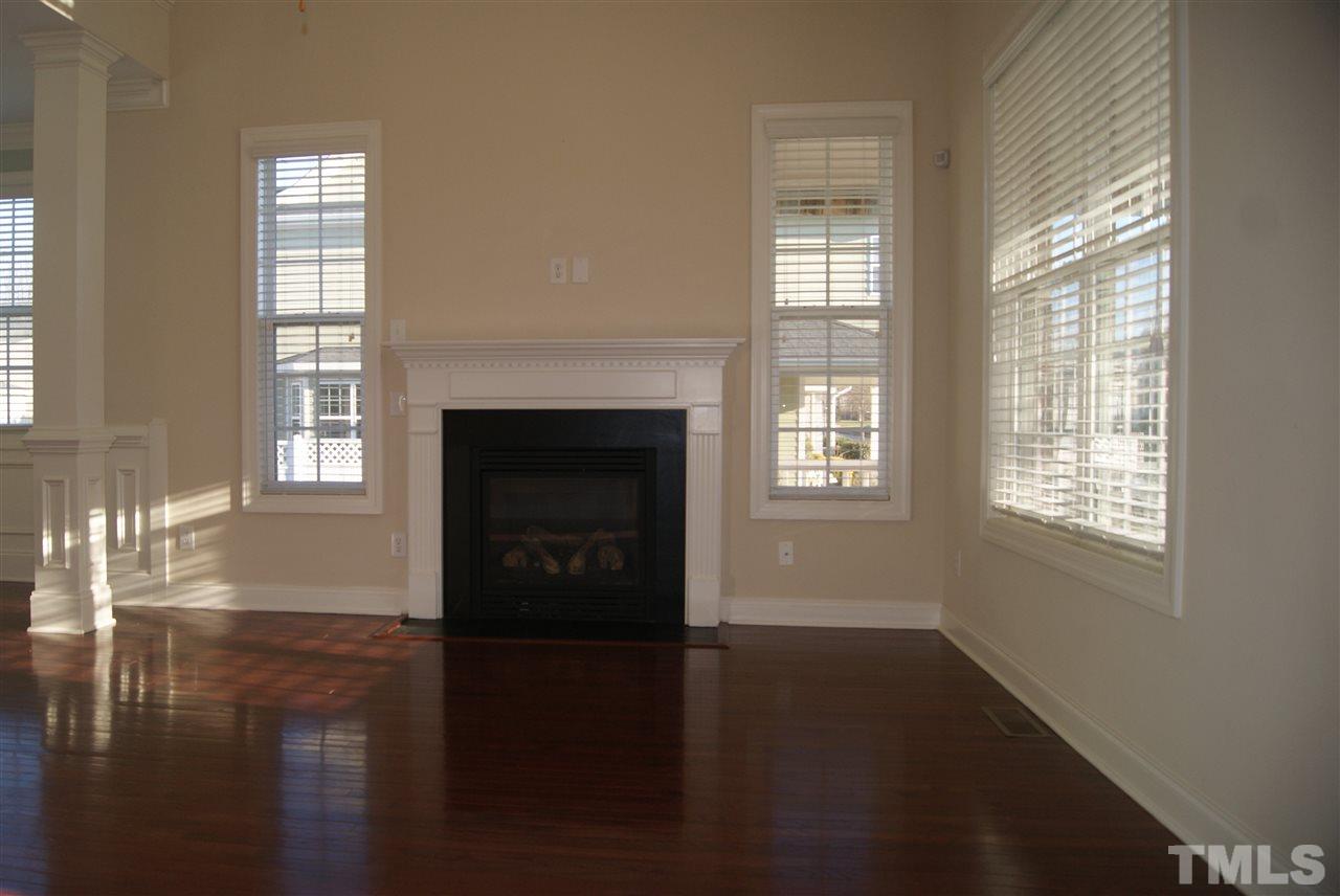 642 Democracy Street Raleigh, NC 27603 - Photo 13 of 25 a view of an empty room with wooden floor and a window