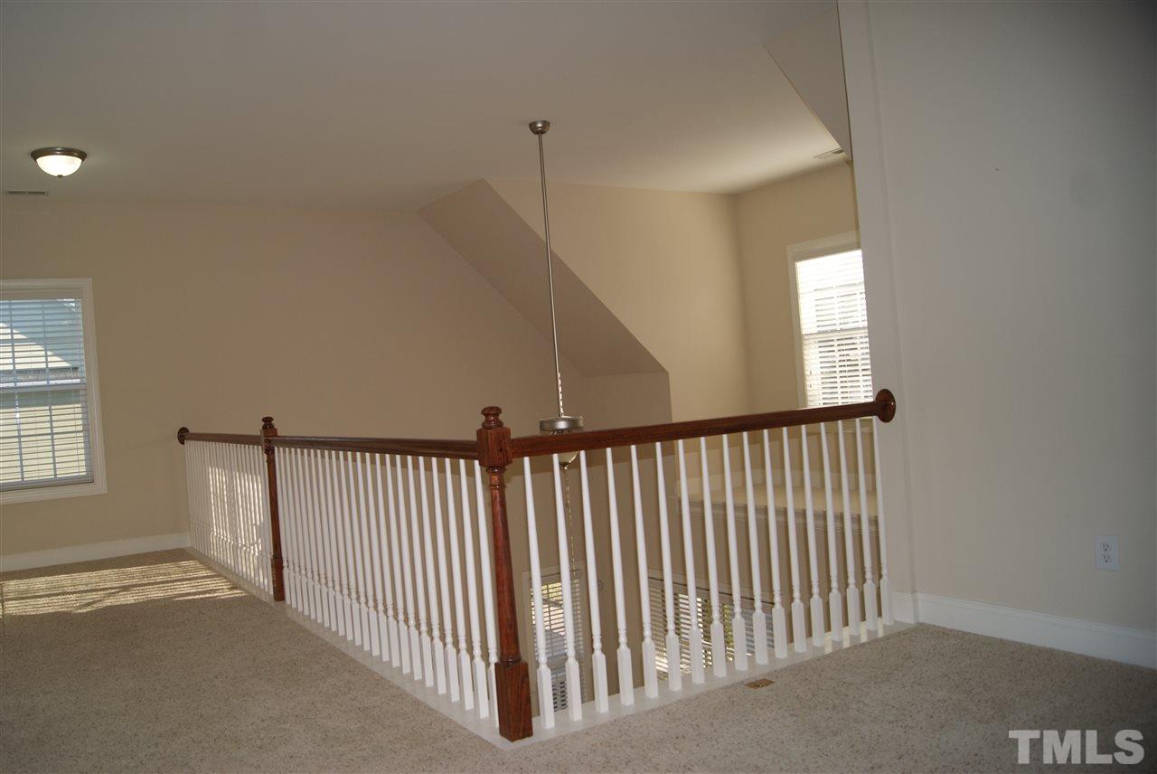 642 Democracy Street Raleigh, NC 27603 - Photo 15 of 25 a view of a hallway with windows