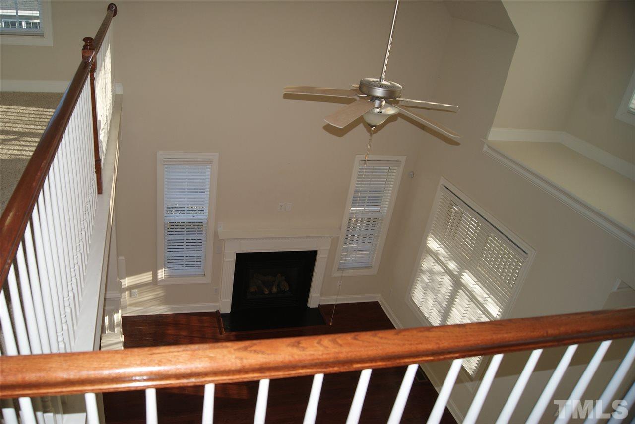 642 Democracy Street Raleigh, NC 27603 - Photo 16 of 25 a view of fireplace window and wooden floor