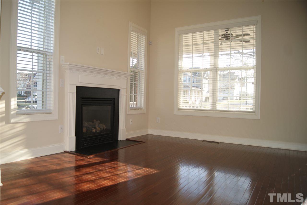 642 Democracy Street Raleigh, NC 27603 - Photo 18 of 25 a view of an empty room with wooden floor and a window