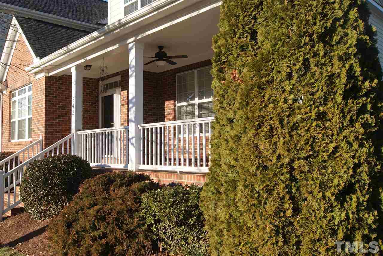 642 Democracy Street Raleigh, NC 27603 - Photo 3 of 25 a view of a house with a small yard and floor to ceiling window
