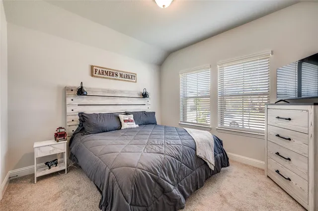 a bathroom with a tub a sink and a window