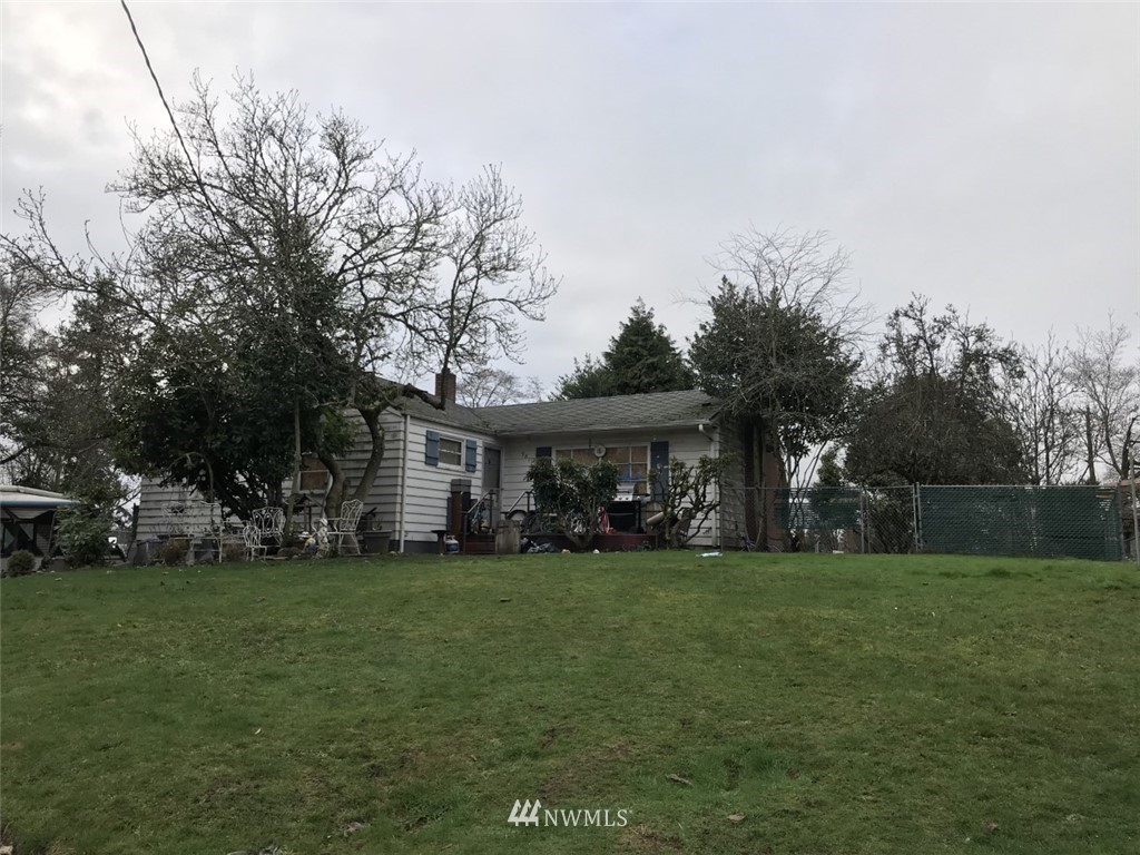 9817 13th Avenue Southwest Seattle, WA 98106 - Photo 2 of 5 a view of a house with a yard