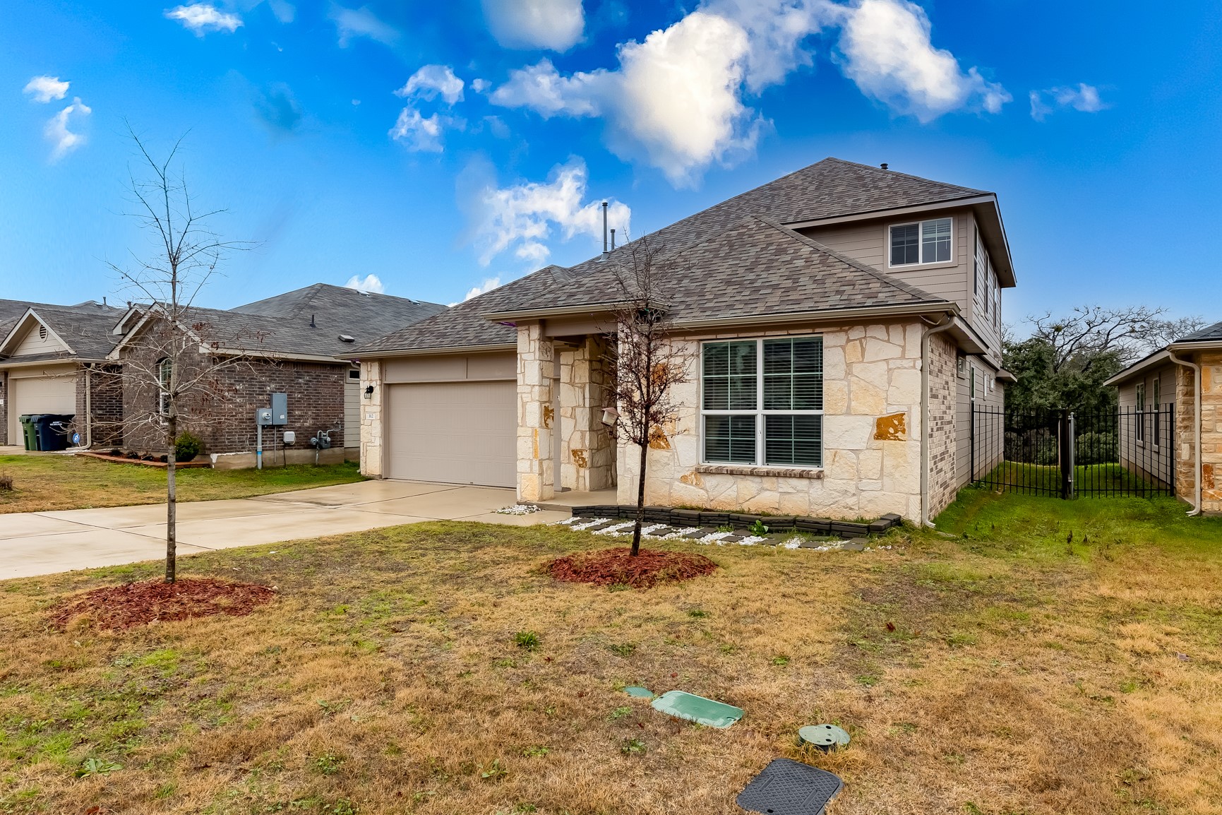 312 Empress Tree Drive Leander, TX 78641 - Photo 2 of 35 a house view with a garden space