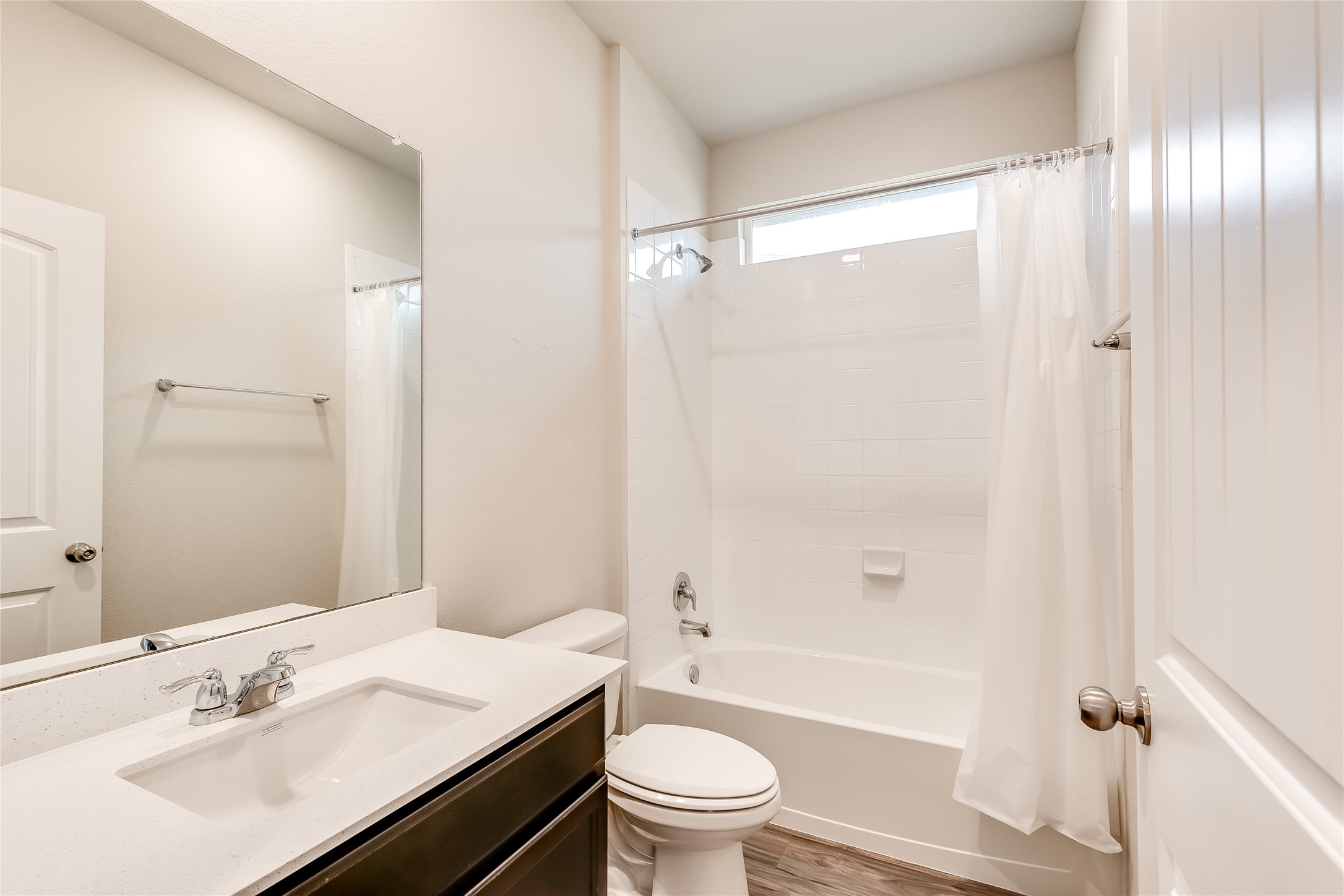 312 Empress Tree Drive Leander, TX 78641 - Photo 20 of 35 a bathroom with a sink a toilet and shower