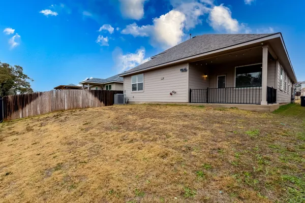 a house view with a backyard space