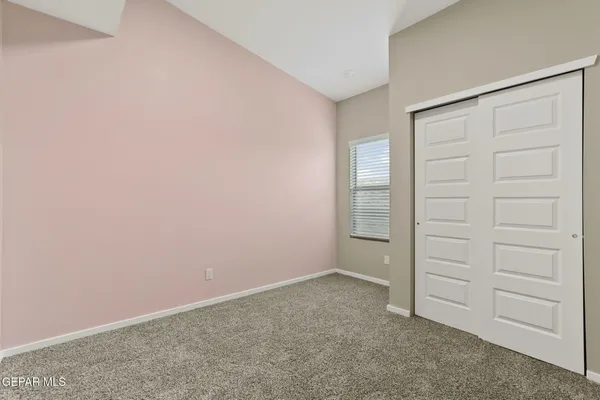an empty room with closet