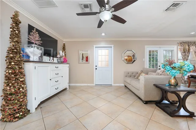 a view of a dining room with furniture and a large window