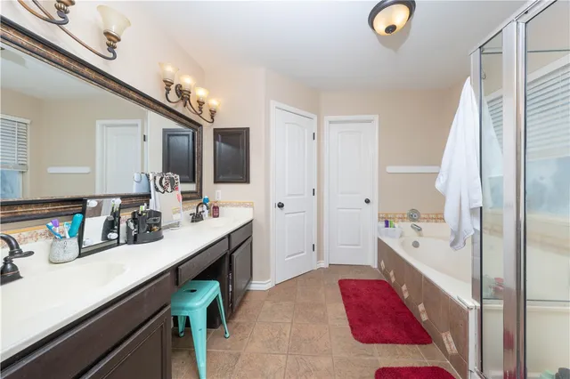a view of a hallway with wooden floor and furniture