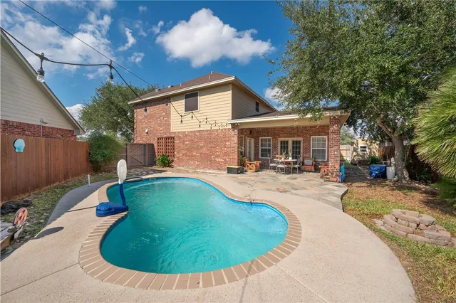 a view of a house with swimming pool