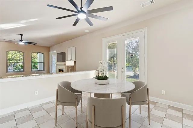 a dining room with furniture and window