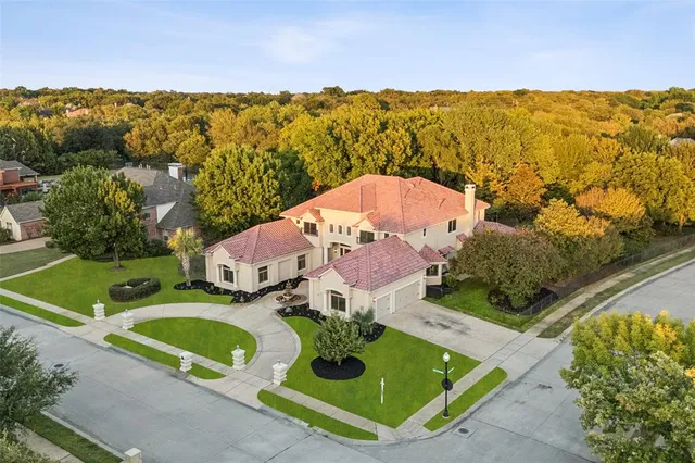 an aerial view of a house with a ocean view