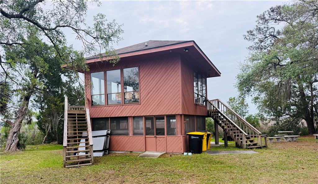 1525 Black Island Road Darien, GA 31305 - Photo 41 of 41 a view of a house with a yard and a slide