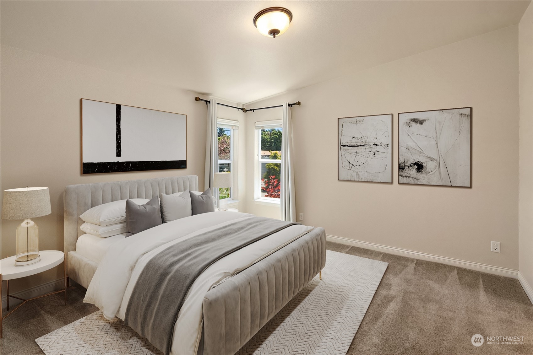 815 Southwest 124th Street, Unit 149 Everett, WA 98204 - Photo 14 of 35 a bedroom with a large bed and a lamp