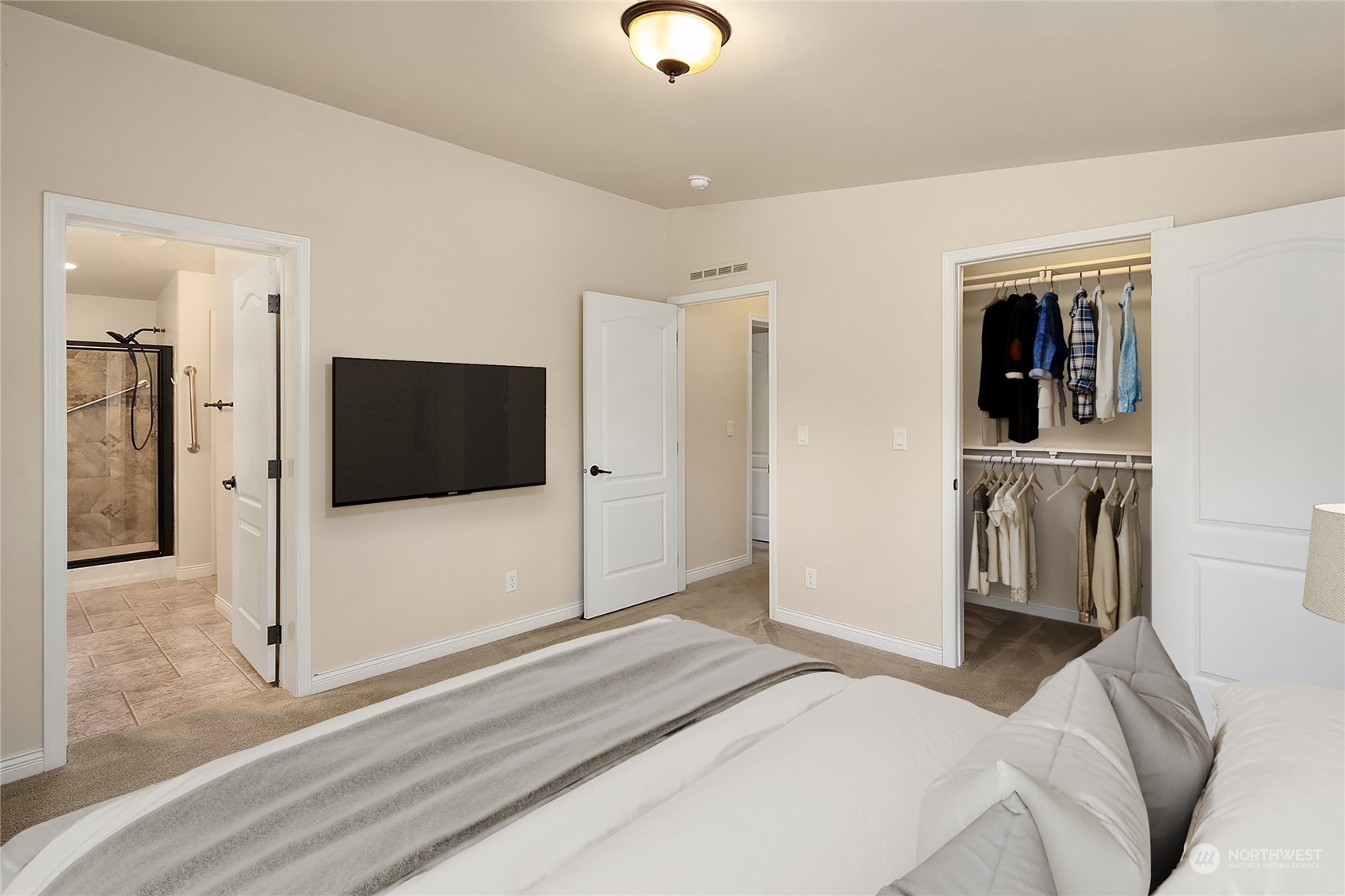 815 Southwest 124th Street, Unit 149 Everett, WA 98204 - Photo 16 of 35 a bedroom with a bed and a television