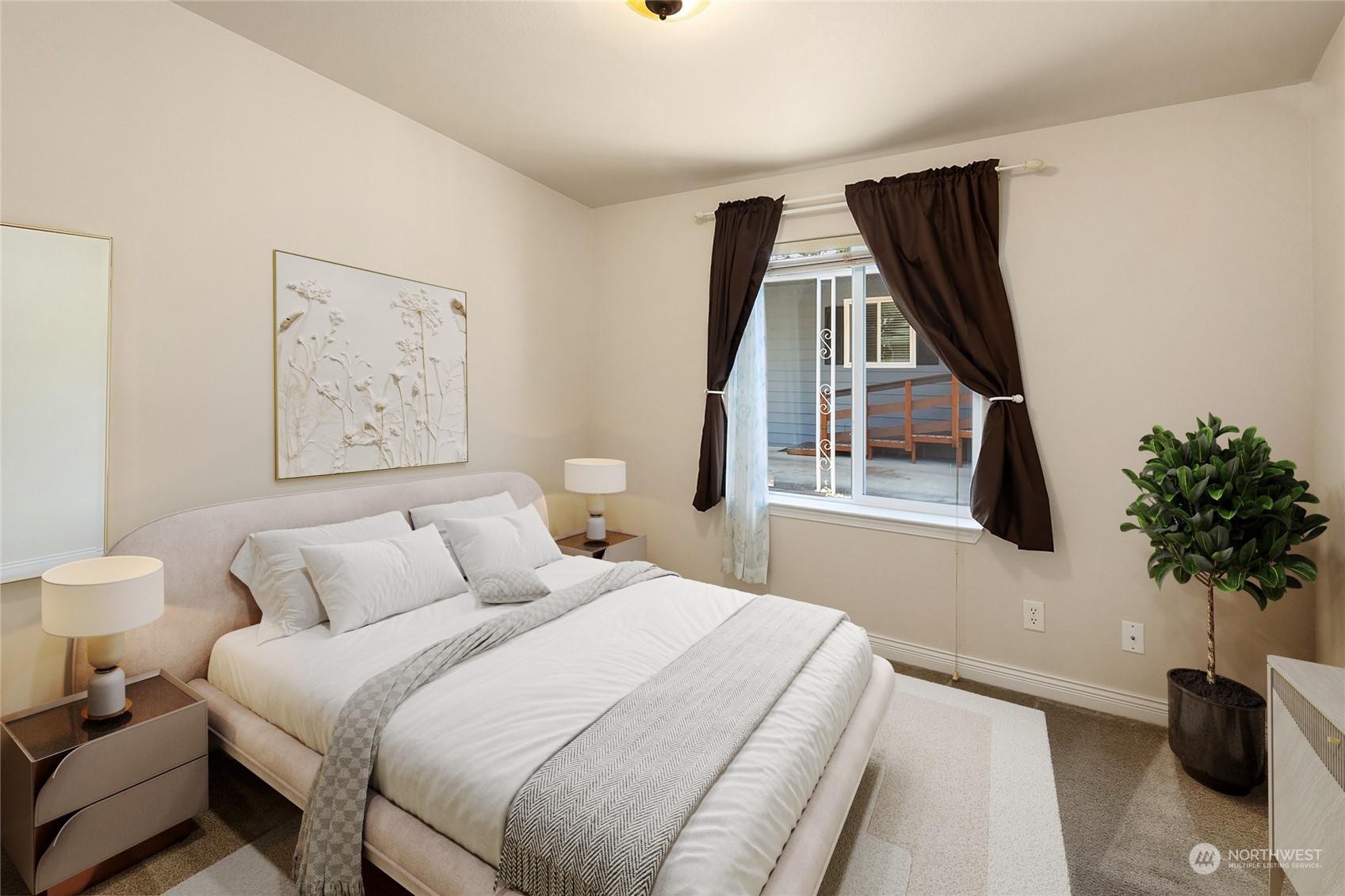 815 Southwest 124th Street, Unit 149 Everett, WA 98204 - Photo 17 of 35 a bedroom with a large bed and a potted plant