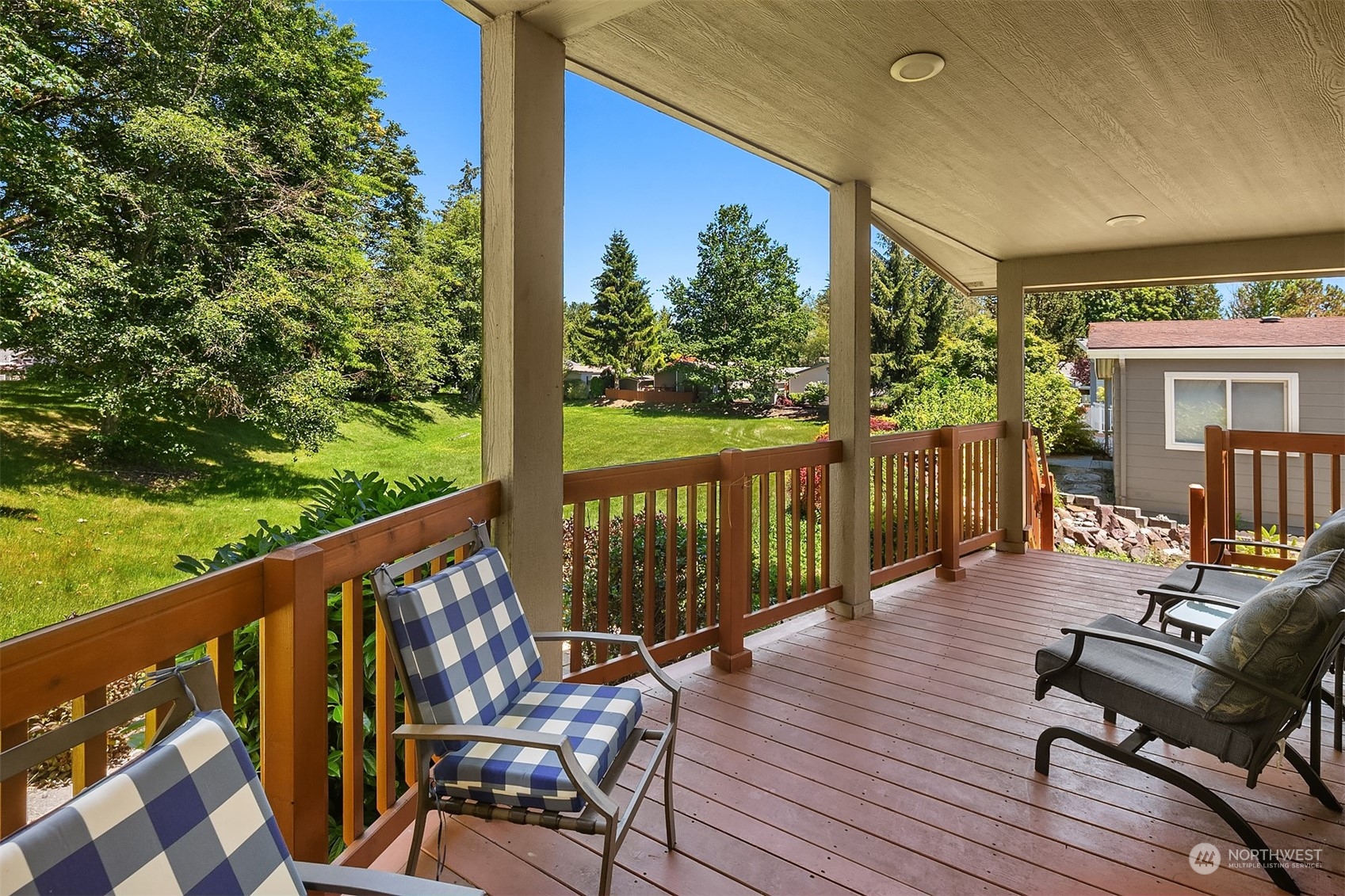 815 Southwest 124th Street, Unit 149 Everett, WA 98204 - Photo 20 of 35 a view of a balcony with wooden floor and outdoor seating
