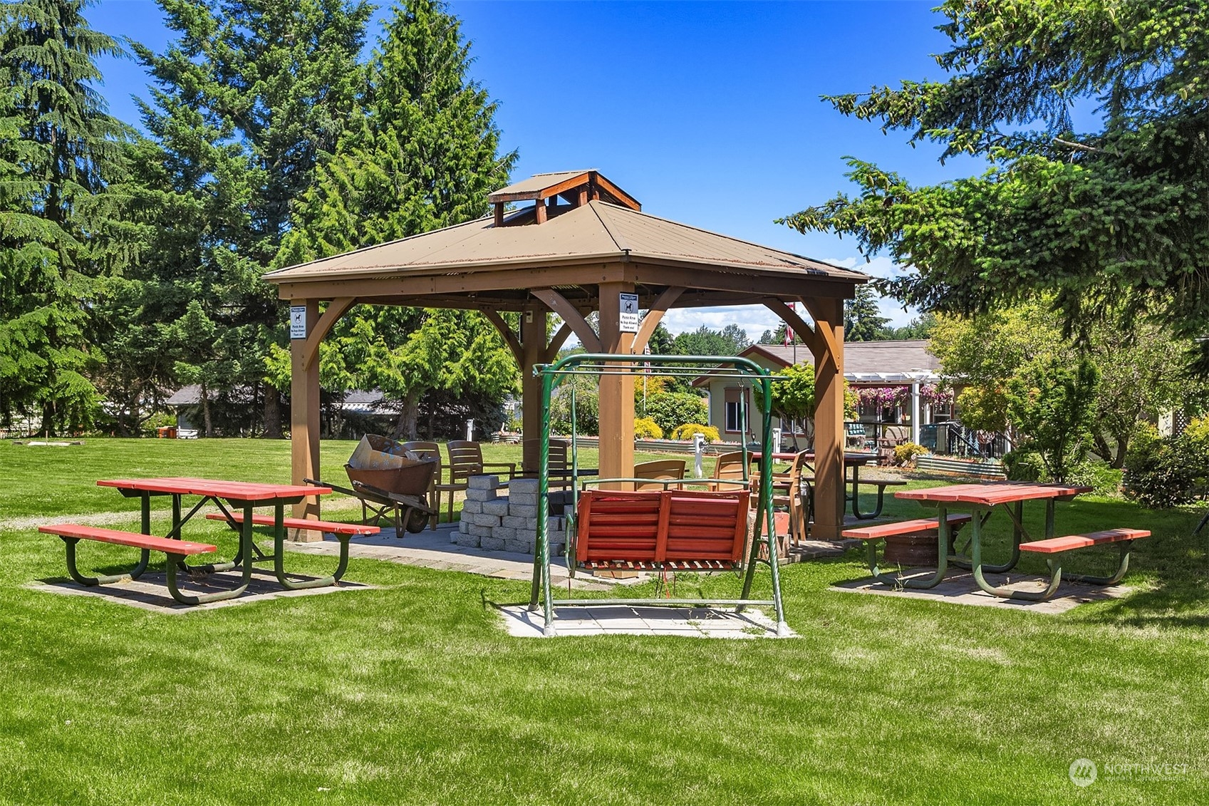 815 Southwest 124th Street, Unit 149 Everett, WA 98204 - Photo 27 of 35 a view of backyard with table and chairs and a slide
