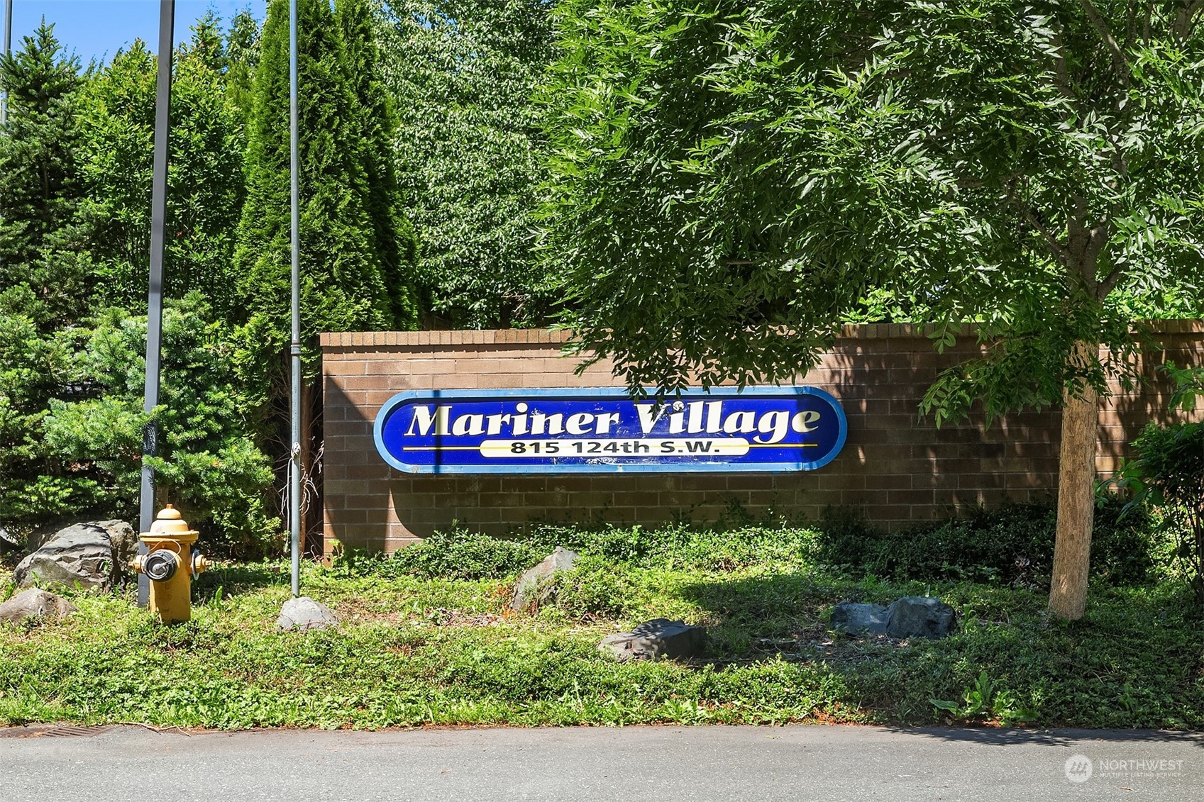 815 Southwest 124th Street, Unit 149 Everett, WA 98204 - Photo 28 of 35 a sign on the side of a road