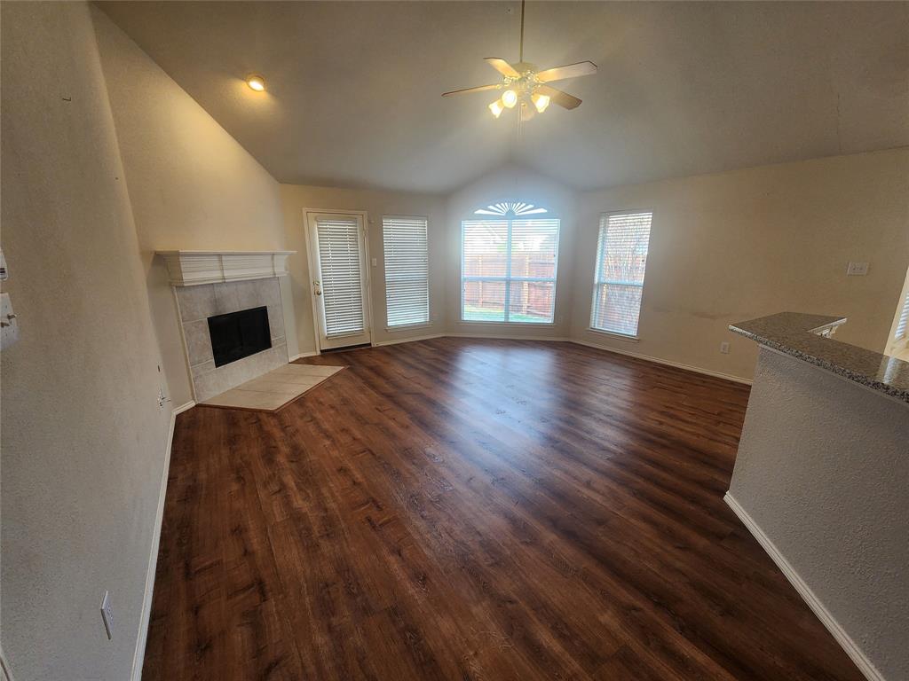 8313 Fountain Ridge Drive Plano, TX 75025 - Photo 11 of 24 a view of an empty room with a window and wooden floor