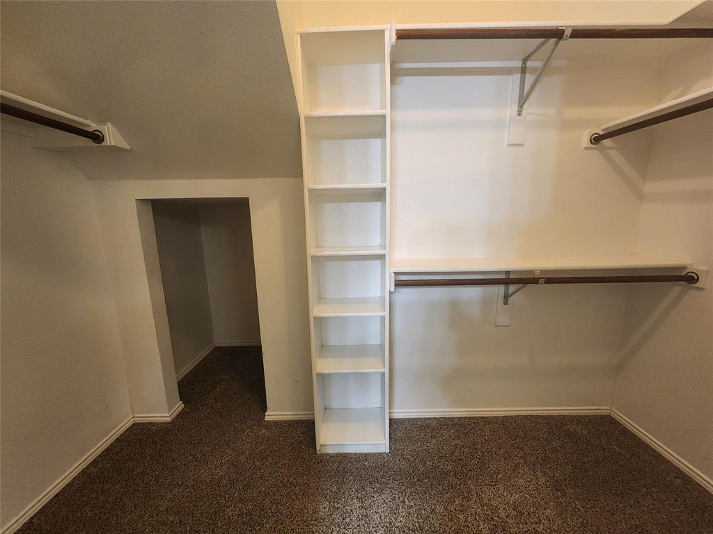 8313 Fountain Ridge Drive Plano, TX 75025 - Photo 17 of 24 a view of walk in closet with empty racks