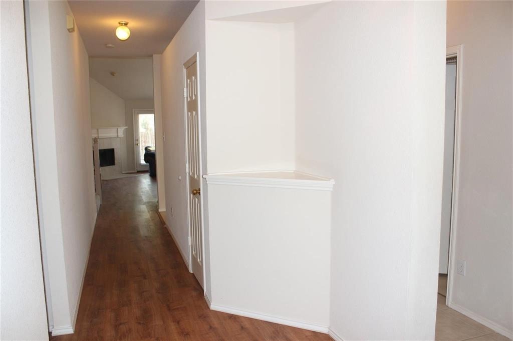 8313 Fountain Ridge Drive Plano, TX 75025 - Photo 3 of 24 a view of a hallway with wooden floor