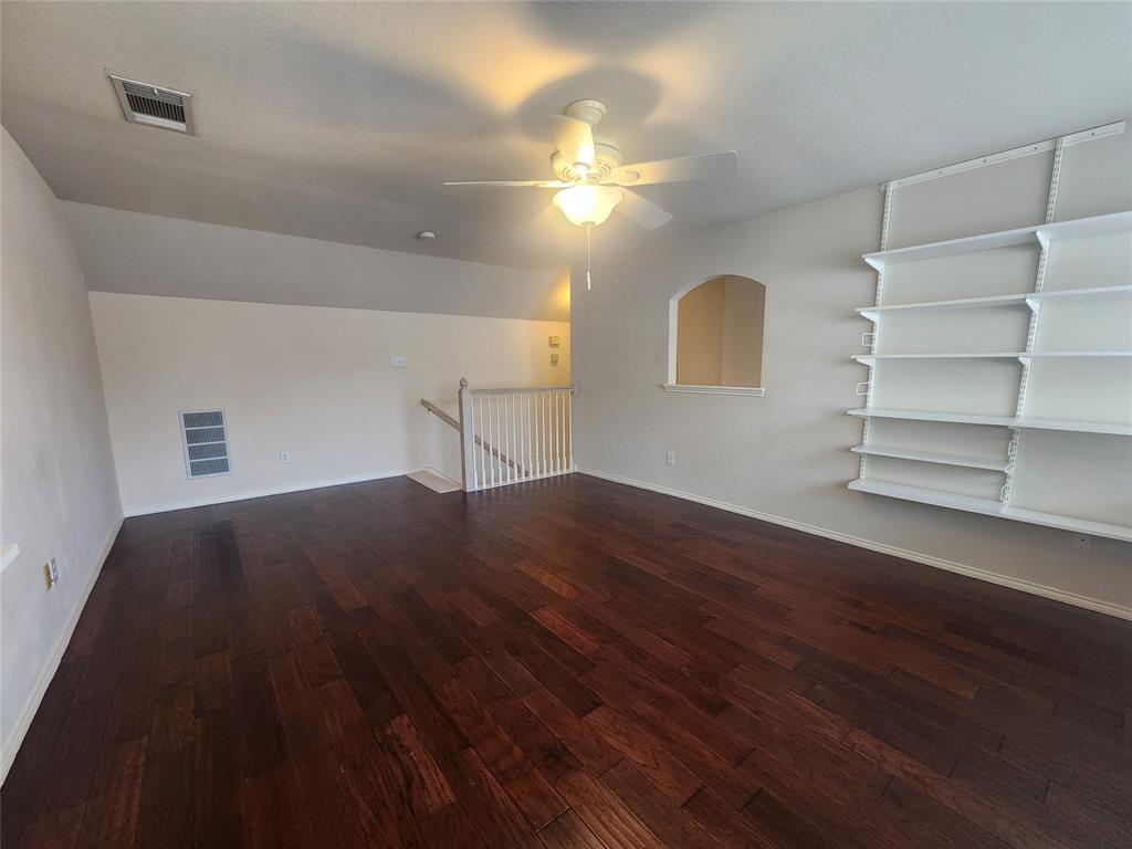 8313 Fountain Ridge Drive Plano, TX 75025 - Photo 4 of 24 a view of a room with wooden floors and fan