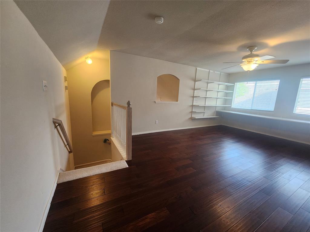 8313 Fountain Ridge Drive Plano, TX 75025 - Photo 7 of 24 an empty room with wooden floor and windows