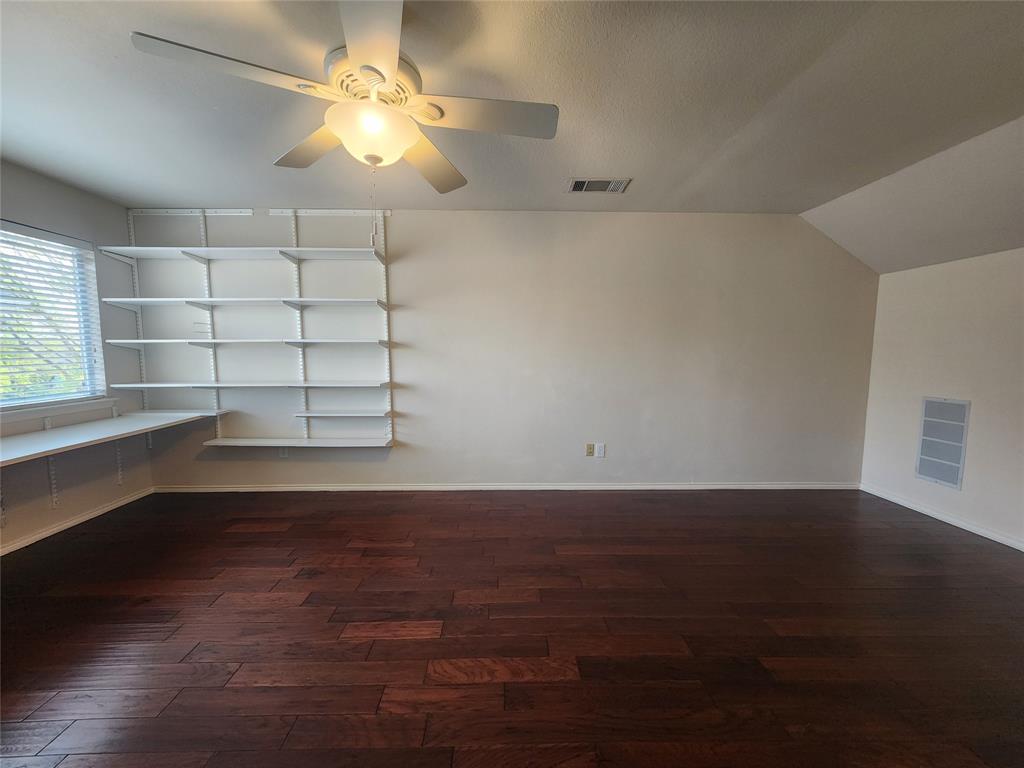 8313 Fountain Ridge Drive Plano, TX 75025 - Photo 9 of 24 a view of a room with wooden floor and windows