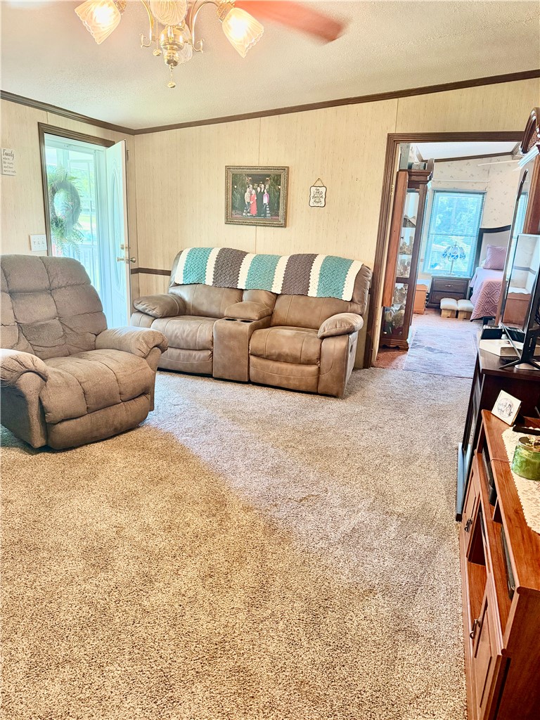 1549 Greenfield Road Westminster, SC 29693 - Photo 23 of 49 Comfortable living area offers a warm ambiance, ideal for relaxation and everyday activities.