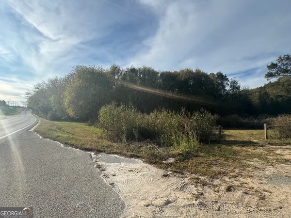 a view of a lake next to a yard