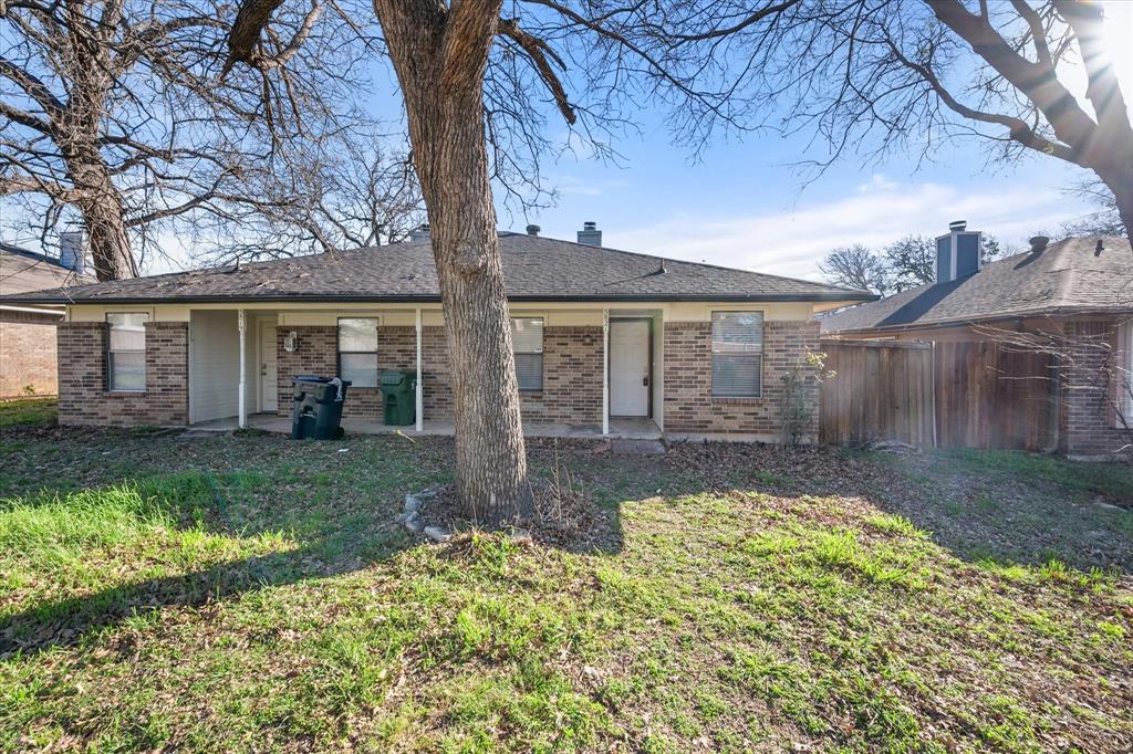 5821 Mansfield Road Arlington, TX 76017 - Photo 5 of 24 front view of a house with a yard