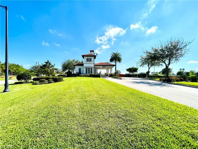 a view of a swimming pool with an outdoor space and seating area