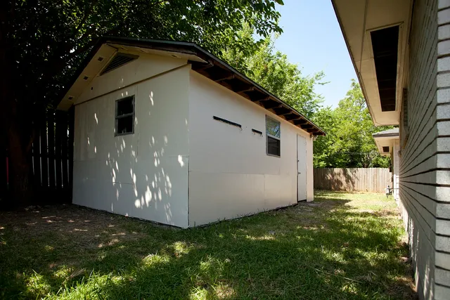 a backyard of a house with lots of green space