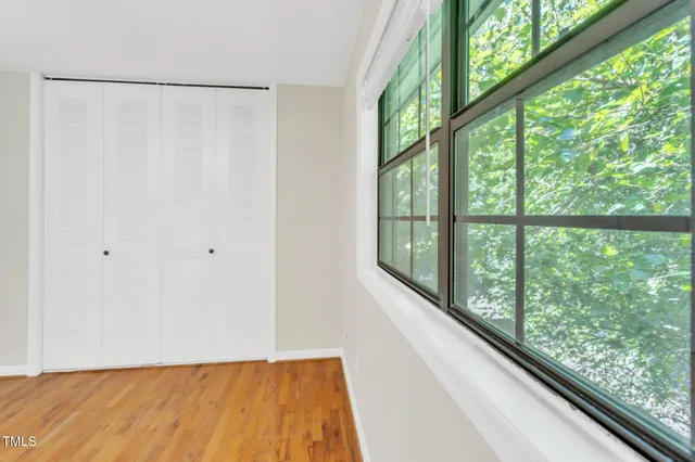 a view of a balcony with wooden floor