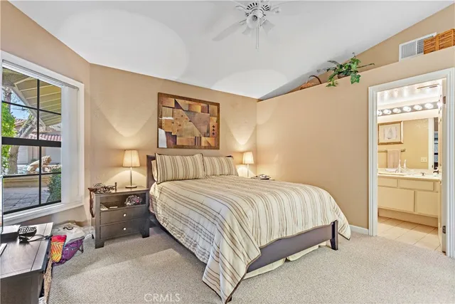 a bedroom with a bed and a cabinets