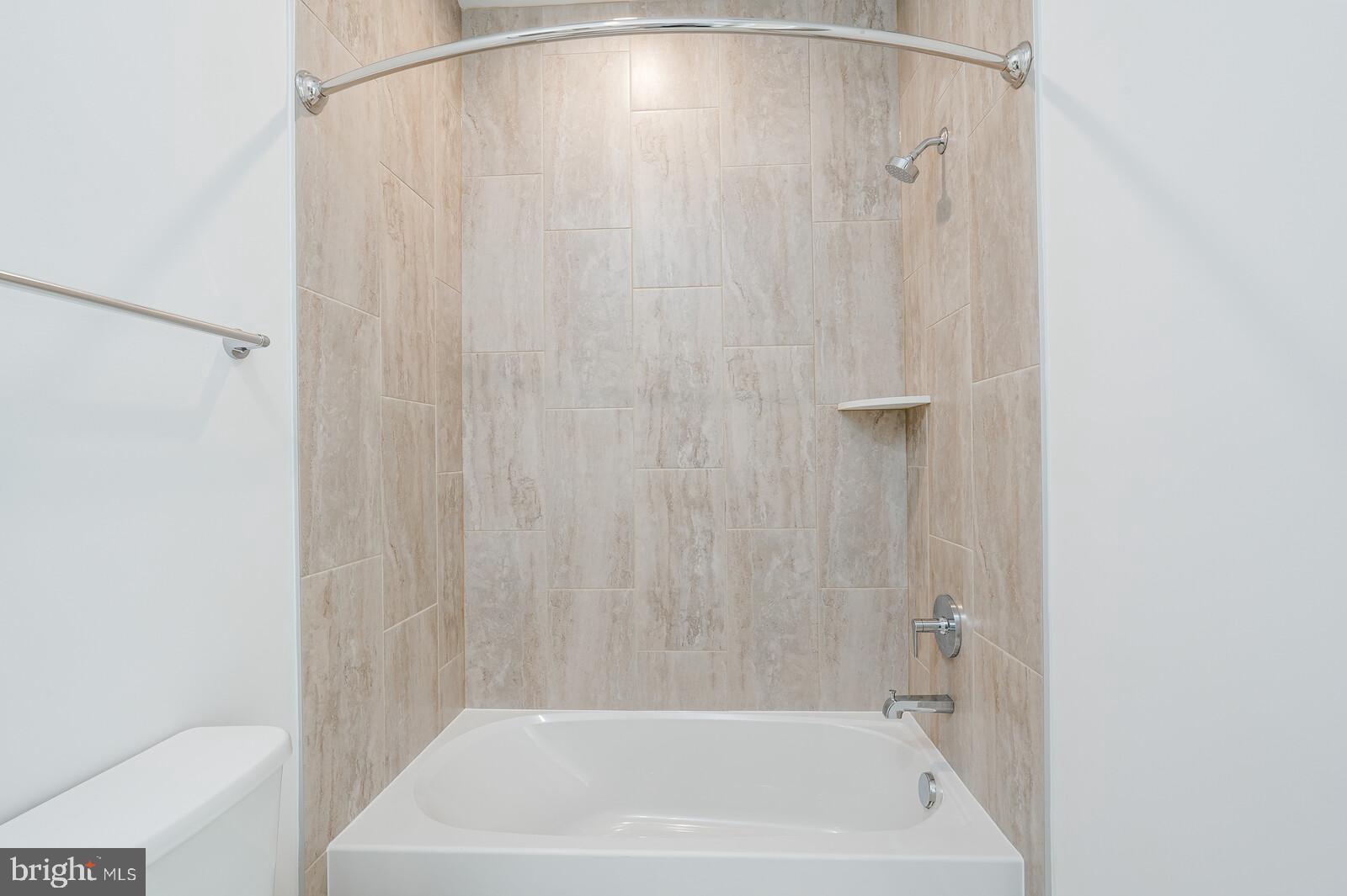 5345 Zenith Overlook Bethesda, MD 20816 - Photo 42 of 53 a bathroom with a shower and a bath tub