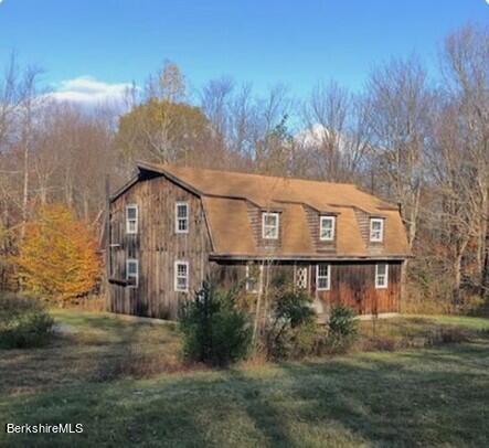 8 Bosworth Road Sandisfield, MA 01255 - Photo 1 of 1 a front view of a house with a yard