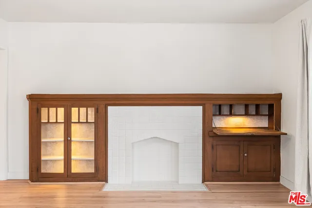 a hallway with a large window and a mirror