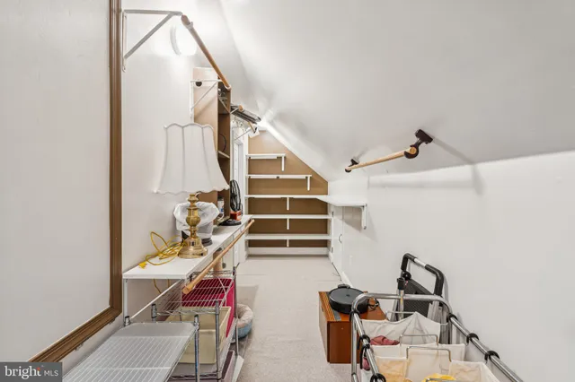 a white bath tub sitting next to a white sink and vanity