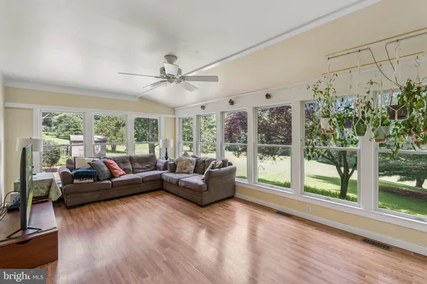 a kitchen with granite countertop stainless steel appliances a refrigerator microwave and stove top oven