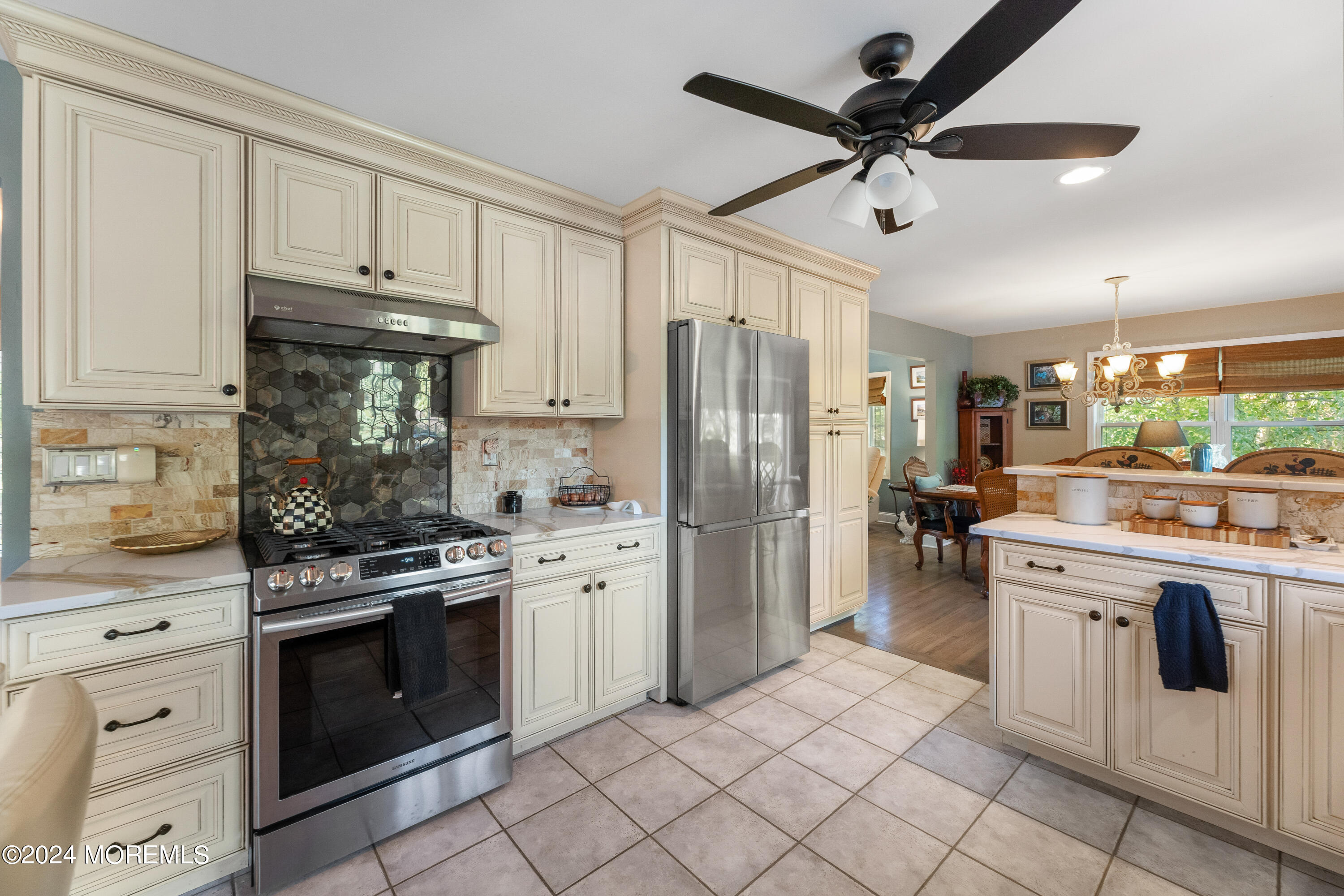 159 Arnold Boulevard Howell, NJ 07731 - Photo 14 of 60 a kitchen with stainless steel appliances granite countertop a stove a refrigerator and a sink