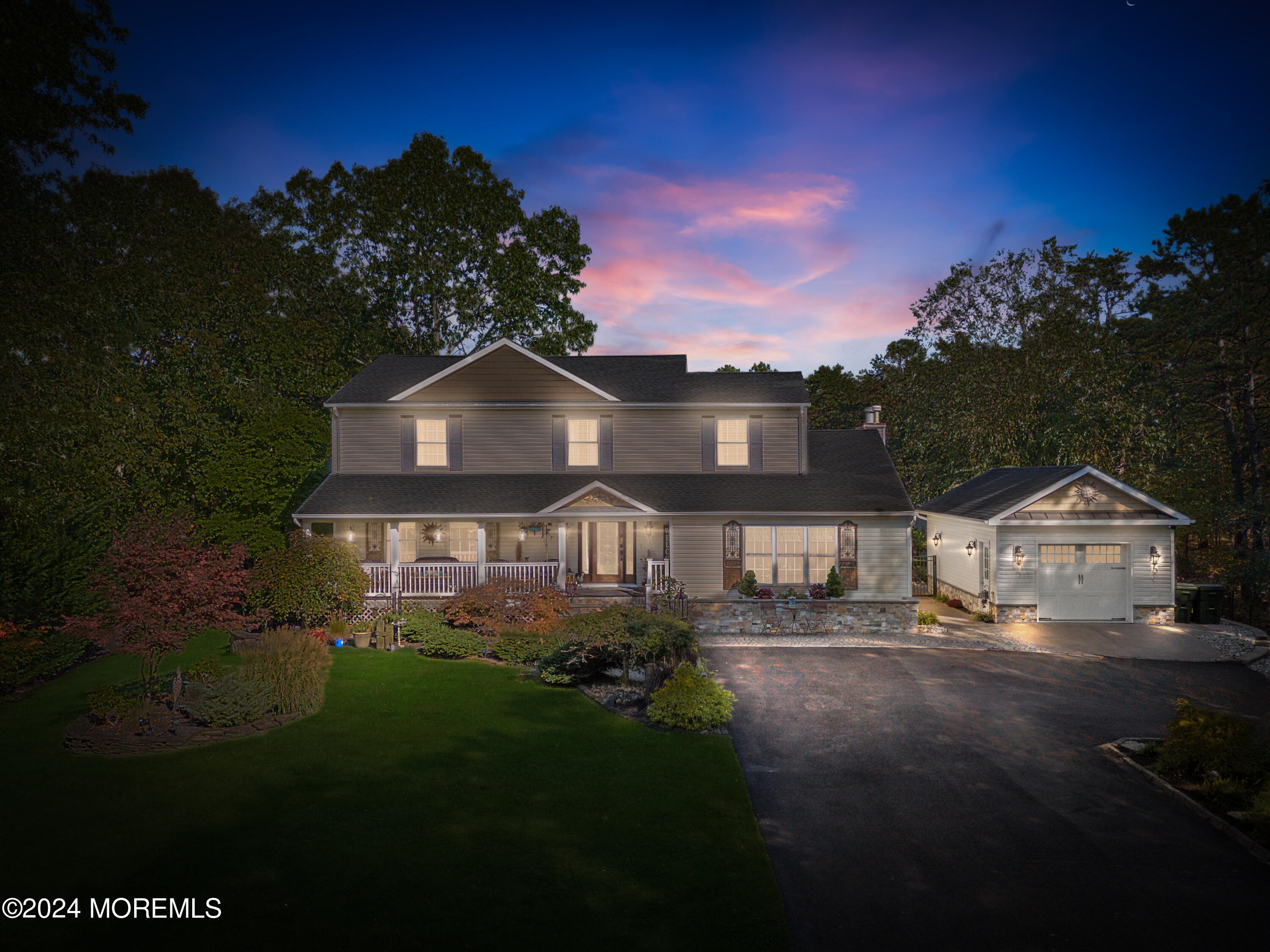 159 Arnold Boulevard Howell, NJ 07731 - Photo 2 of 60 a front view of a house with a garden and yard