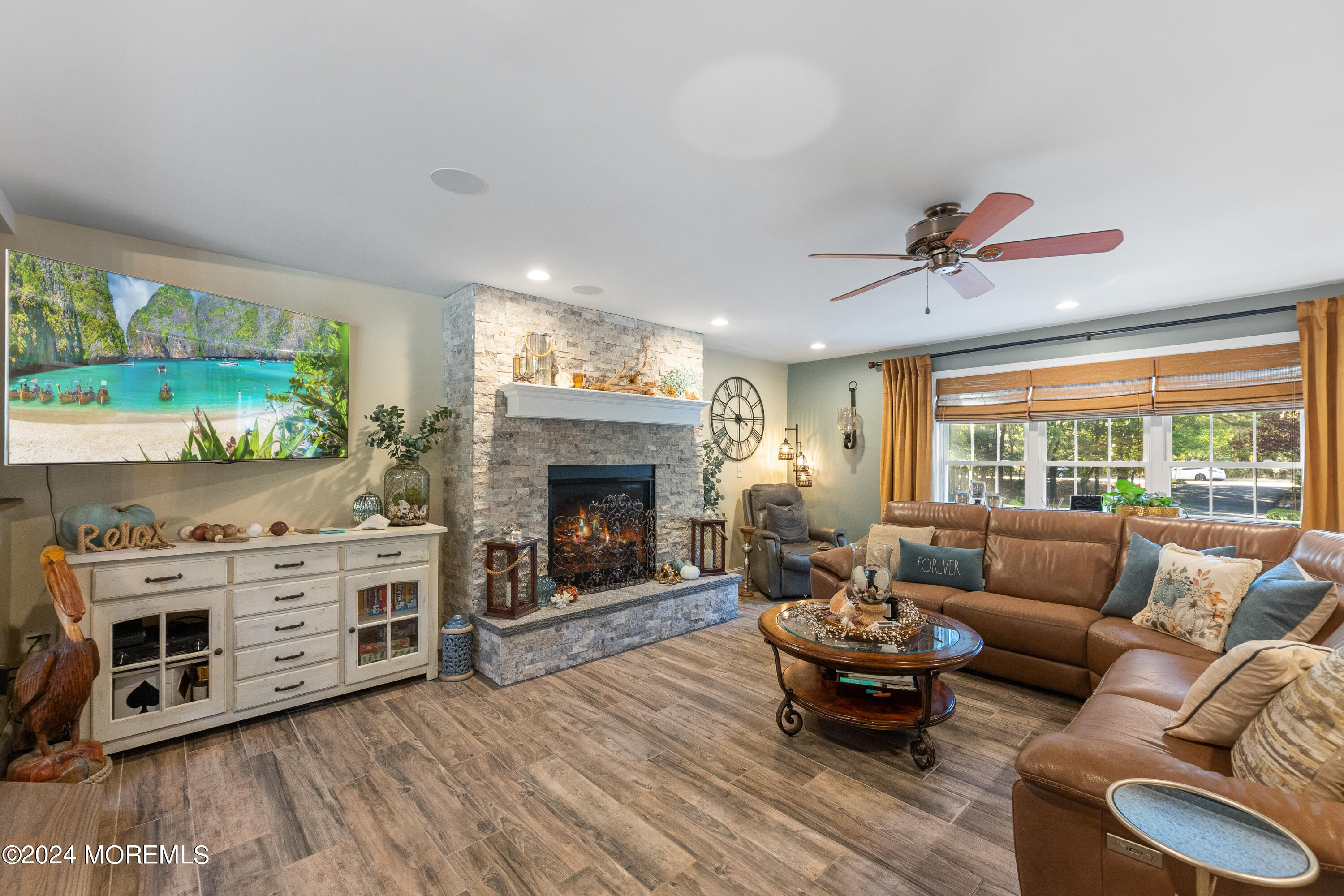 159 Arnold Boulevard Howell, NJ 07731 - Photo 22 of 60 a living room with furniture and a fireplace